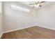 Bright, empty bedroom with hardwood floors, neutral walls, and ceiling fan at 1299 Osceola St, Denver, CO 80204