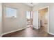 Bedroom featuring wood floors, a window, and a glass door leading to a balcony at 1299 Osceola St, Denver, CO 80204