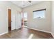 This is a bedroom with wood floors, a window, and a door leading to a balcony at 1299 Osceola St, Denver, CO 80204