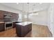 Kitchen featuring a modern island with sleek countertops and stainless steel appliances at 1299 Osceola St, Denver, CO 80204