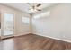 Light-filled living room with hardwood floors and access to outdoor balcony at 1299 Osceola St, Denver, CO 80204