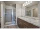 Modern bathroom with spacious glass shower and stylish double vanity at 814 N Bently St, Watkins, CO 80137