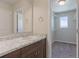 Bathroom features a single sink vanity with granite countertop and modern fixtures at 814 N Bently St, Watkins, CO 80137