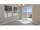 Bright dining area with sliding glass door and modern chandelier at 814 N Bently St, Watkins, CO 80137