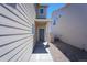 Home exterior showcasing the front entrance with a view of the side yard at 814 N Bently St, Watkins, CO 80137