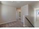 Second floor hallway with carpet and neutral colored walls at 814 N Bently St, Watkins, CO 80137