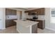 A kitchen featuring wooden cabinets, granite countertops, and stainless steel appliances at 814 N Bently St, Watkins, CO 80137