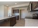 Kitchen featuring stainless steel appliances, wooden cabinets, and light countertops at 814 N Bently St, Watkins, CO 80137