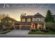 Inviting two-story home boasts stone accents, a two-car garage, and a beautifully landscaped front yard at 4307 Lilly Gulch Trl, Castle Rock, CO 80109