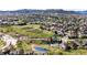 Breathtaking aerial view of the community showcasing lush green spaces, scenic walking trails, and a serene pond at 4307 Lily Gulch Trl, Castle Rock, CO 80109