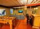 Finished basement features a lounge area, foosball table, and bar seating, perfect for entertaining at 4307 Lily Gulch Trl, Castle Rock, CO 80109