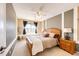 Bedroom featuring natural light, neutral colors, and carpeted floors at 4307 Lily Gulch Trl, Castle Rock, CO 80109