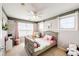 Bedroom featuring natural light, ceiling fan, and playful decor at 4307 Lily Gulch Trl, Castle Rock, CO 80109