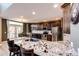 Spacious kitchen featuring granite countertops, stainless steel appliances, and dark wood cabinetry at 4307 Lily Gulch Trl, Castle Rock, CO 80109