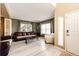Cozy living room featuring hardwood floors, comfortable seating, and natural light at 4307 Lily Gulch Trl, Castle Rock, CO 80109