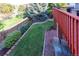 Private backyard featuring a red brick patio and a well-maintained lawn with lush landscaping at 3259 W 111Th Drive, Westminster, CO 80031