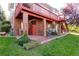 Backyard patio with a seating area, accessible by stairs from a second story deck, perfect for outdoor relaxation at 3259 W 111Th Drive, Westminster, CO 80031
