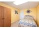Cozy bedroom with yellow walls, carpet floors, a comfortable bed, and a wooden closet for ample storage at 3259 W 111Th Drive, Westminster, CO 80031