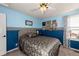 Bedroom featuring a queen sized bed, a ceiling fan, two-toned walls, and carpet flooring at 3259 W 111Th Drive, Westminster, CO 80031