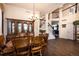 Spacious dining area with hardwood floors, chandelier, and staircase to the upper level at 3259 W 111Th Drive, Westminster, CO 80031