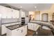 Open kitchen with stainless steel appliances, granite countertops, and ample cabinet space at 3259 W 111Th Drive, Westminster, CO 80031
