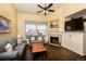 Comfortable living room features a fireplace, plush seating, and natural light at 3259 W 111Th Drive, Westminster, CO 80031
