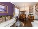 Elegant living and dining area with hardwood floors, decorative furniture, and abundant natural light at 3259 W 111Th Drive, Westminster, CO 80031