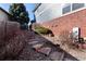 Side yard with a stone path and low-maintenance landscaping, providing an outdoor retreat at 3259 W 111Th Drive, Westminster, CO 80031