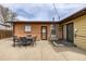 Back patio featuring outdoor seating with brick and siding on the house at 5070 W 66Th Ave, Arvada, CO 80003