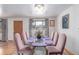 Elegant dining room with seating for eight and a stylish chandelier at 5070 W 66Th Ave, Arvada, CO 80003
