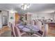 Open-concept dining area with view into the living room at 5070 W 66Th Ave, Arvada, CO 80003