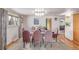 Formal dining room featuring a glass table, plush seating, and elegant lighting at 5070 W 66Th Ave, Arvada, CO 80003