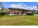Well-maintained brick home with a landscaped front yard and mature shrubbery at 5070 W 66Th Ave, Arvada, CO 80003