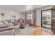 Cozy living room featuring plush seating, hardwood floors, and natural light at 5070 W 66Th Ave, Arvada, CO 80003
