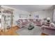 Comfortable living room with a plush sofa, glass coffee table, and modern decor at 5070 W 66Th Ave, Arvada, CO 80003