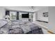 Spacious bedroom with large windows, a ceiling fan, and an attached soaker tub at 5070 W 66Th Ave, Arvada, CO 80003