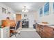 Charming office space with wood rolltop desk and neutral carpeting at 5070 W 66Th Ave, Arvada, CO 80003