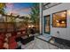 Modern backyard patio with seating area, string lights, and grill at 2257 S High St, Denver, CO 80210