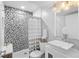 Basement bathroom with hexagon tile shower and vanity at 2257 S High St, Denver, CO 80210