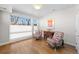 Bright bedroom with hardwood floors and large window at 2257 S High St, Denver, CO 80210
