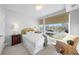 Cozy bedroom with a comfortable bed and ample natural light at 2257 S High St, Denver, CO 80210