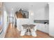 Bright dining area with hardwood floors and a modern round table at 2257 S High St, Denver, CO 80210