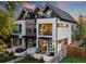 Modern two-story home with a mix of brick and white walls, and a fenced yard at 2257 S High St, Denver, CO 80210