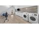 Laundry room with washer, dryer, and built-in cabinets at 2257 S High St, Denver, CO 80210