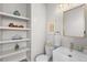 Powder room with floating shelves and modern vanity at 2257 S High St, Denver, CO 80210