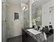 Modern bathroom features sleek tile, glass shower, and contemporary vanity with attractive fixtures at 3715 Kalamath St, Denver, CO 80211