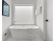 Serene bathroom featuring a freestanding tub, sleek fixtures, and minimalist decor at 3715 Kalamath St, Denver, CO 80211