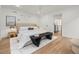 Bright bedroom with wood floors features a modern design and neutral color palette with minimalist decor at 3715 Kalamath St, Denver, CO 80211