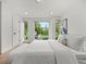 Sunlit bedroom features a large window providing scenic views, enhancing the bright and airy space at 3715 Kalamath St, Denver, CO 80211
