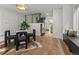 Bright dining area with modern furnishings, opening to a staircase and living space at 3715 Kalamath St, Denver, CO 80211